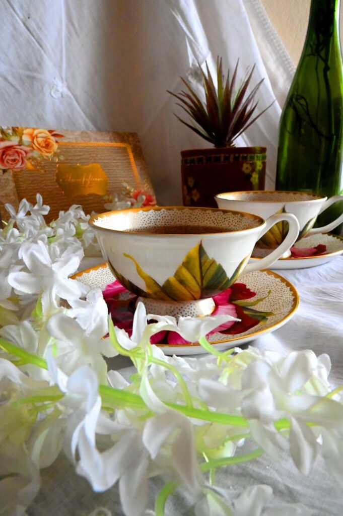 White and Pink Floral Ceramic Teacup on Saucer